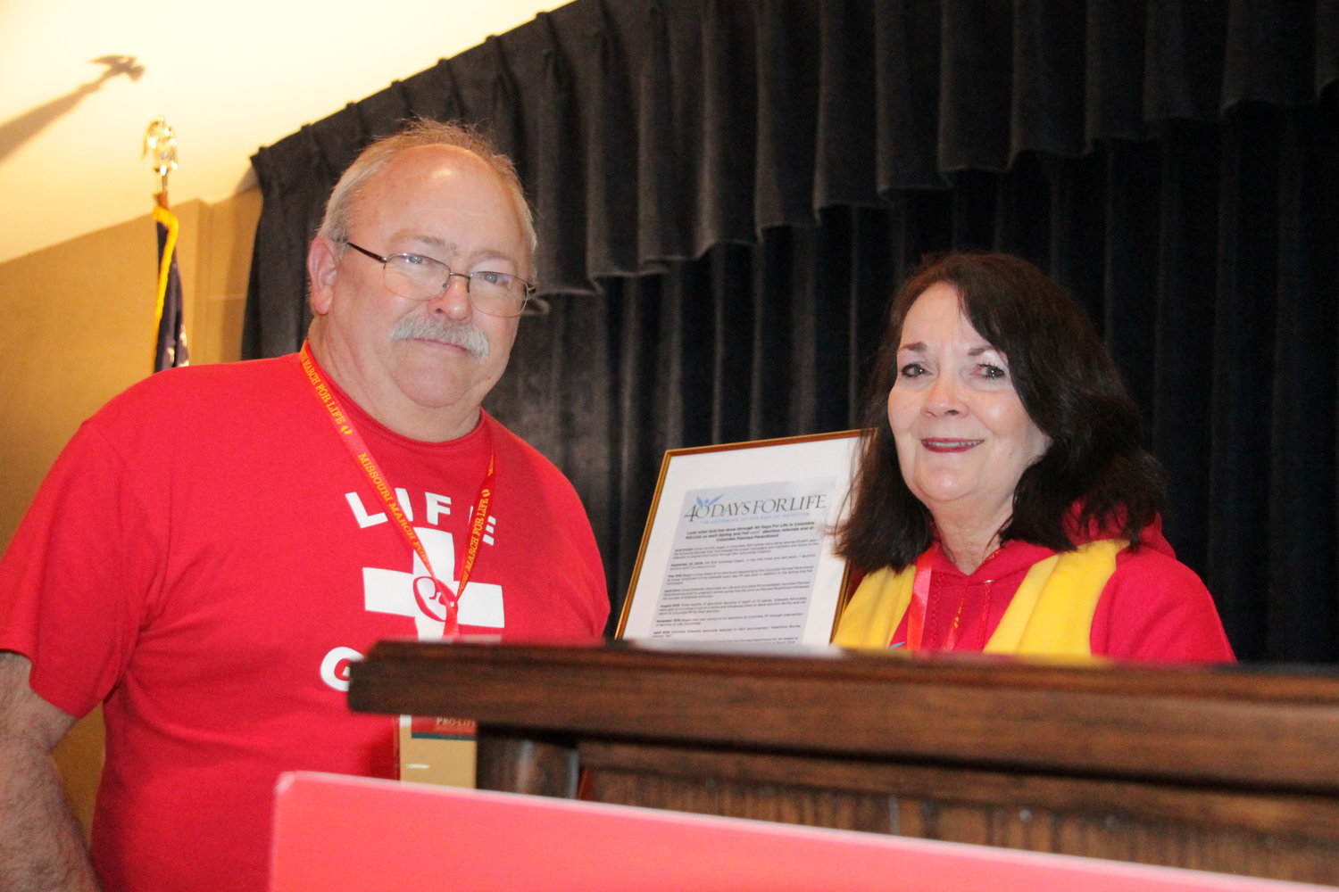 Mike and Kathy Forck, leaders of the Columbia 40 Days for Life Campaign and the Midwest March for Life, accept special recognition from 40 Days for Life during a rally at the end of this year’s march.